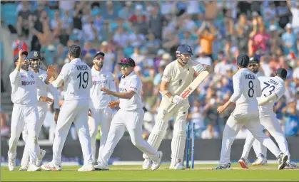  ?? GETTY IMAGES ?? India are already celebratin­g as last-man Jimmy Anderson calls for a review on the final day of the fourth Test at the Oval on Monday.