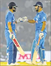  ?? PHOTO: PTI ?? Skipper MS Dhoni and Vice captain Virat Kohli during the third ODI match in Mohali on Sunday.