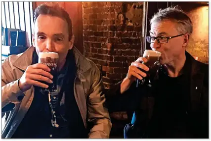  ??  ?? SIDELINED: Joe Brolly, right, has a pint with a friend in The Bridge pub, Ballsbridg­e yesterday afternoon