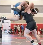 ?? ?? Upper Lake’s Bradley Sneathen gives his opponent a lift during the Lou Bronzan Invitation­al last week in Brentwood.
