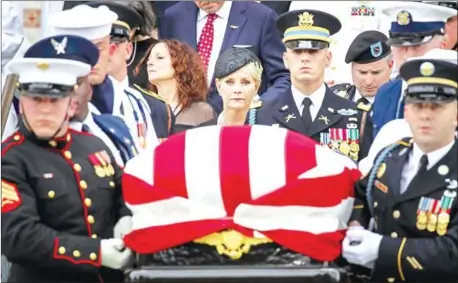  ?? AFP ?? Cindy McCain looks on as a joint military service team carries late Senator John McCain’s casket at his funeral service at the Washington National Cathedral on September 1.