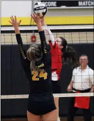  ?? RANDY MEYERS — FOR THE MORNING JOURNAL ?? Brookside’s Paige Grobolsek taps the ball over Lilly Nixon of Black River during the second game Oct. 28.