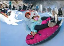  ?? XINHUA ?? Sledding in Qinhuangda­o, North China’s Hebei province, on Feb 4, as people’s enthusiasm for winter sports heats up.