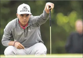  ?? STACY REVERE / GETTY IMAGES ?? Rickie Fowler lines up a birdie putt on the 10th hole during Thursday’s first round of the Houston Open. Fowler sank it for one of eight birdies in his 64.