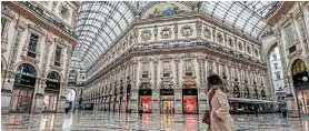  ?? Picture: MIGUEL MEDINA/AFP ?? UNPRECEDEN­TED MEASURES: A woman walks across the deserted Vittorio Emanuele II galleria shopping mall in Milan, Italy, yesterday