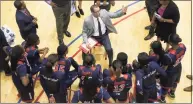  ?? Associated Press file photo ?? St. John’s head coach Joe Tartamella, center, talks to his players during a game against DePaul. The Red Storm host UConn on Sunday afternoon.