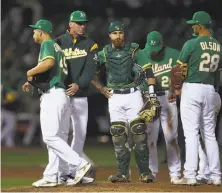  ?? Ben Margot / Associated Press ?? A’s starter Kendall Graveman walks off after being removed by manager Bob Melvin in the sixth inning.