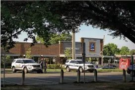  ?? GABRIELLA DEMCZUK / THE NEW YORK TIMES ?? Security surrounds the GOP congressio­nal baseball practice last month at Eugene Simpson Stadium Park in Alexandria, Va., where a shooter attacked last June. The Republican­s play the Democrats on Thursday evening at Nationals Park.