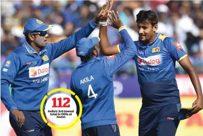  ?? PTI ?? India’s 3rd-lowest total in ODIs at home Lanka’s Lakmal (right) is greeted by Mathews (left) and Dananjaya after completion of his excellent spell against India in Dharamsala. —