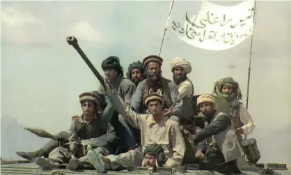  ?? Photograph: Michel Porro/AFP/Getty Images ?? ‘When Moscow withdrew its aid in 1992 (like Trump and Biden today), the modernisin­g regime quickly fell.’ Mujahideen patrol the road from Kabul to Jalalabad, 4 May 1992.