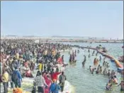  ?? HT PHOTO ?? Devotees taking a dip at the Sangam on Monday.