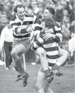  ?? ?? Kelso players – Eric Paxton lifting Alan Tait and Andrew Ker to the left – celebrate after the Jed-forrest v Kelso final of the Melrose Sevens in April 1988. Kelso won the match 14-10