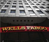  ?? JUSTIN SULLIVAN / GETTY IMAGES 2017 ?? San Francisco-based Wells Fargo & Co. was banned from growing until it convinces authoritie­s it’s addressing shortcomin­gs — an action that could cost it $400 million in profit this year. The sanction marks an apex for central-bank enforcemen­t.