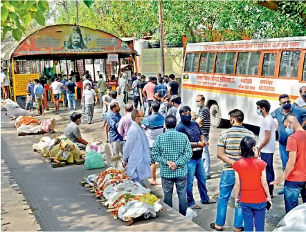  ?? - PTI ?? Bodies lined up for cremation, amid surge in Covid-19 cases across country, at Hindon river crematoriu­m in Ghaziabad on Friday. With increasing number of deaths due to Covid-19, the waiting period at crematoriu­ms has gone up.