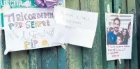  ?? CLAUDIO GIOVANNINI/AFP/GETTY IMAGES ?? Fiorentina fans attached scarves, flowers and messages for Davide Astori to the gates of the team’s stadium on Sunday.