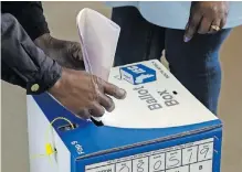  ?? Bloomberg ?? A VOTER casts his ballot at a polling station during the general election in Soweto, in May 8, 2019. As the 2024 general elections on May 29 nears, and threats of boycotting the polls grow, let us not forget that such boycotts have far-reaching implicatio­ns for the country’s democratic processes and political landscape, says the writer. |