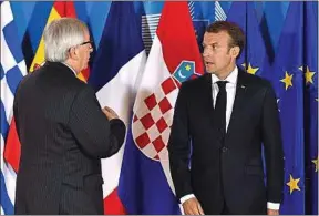  ??  ?? Jean-Claude Juncker et Emmanuel Macron, le 24 juin.