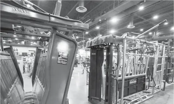  ?? Karen Warren / Houston Chronicle ?? Morgan Livestock Equipment's cattle chutes are on display. The distributo­r says it sells equipment primarily from a company that uses exclusivel­y U.S. steel.