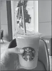  ?? PROVIDED TO CHINA DAILY ?? A Starbucks drink with a paper straw is provided to a customer at a store in Zhengzhou, Henan province.