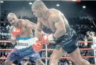  ?? Picture:GETTY IMAGES ?? READY TORUMBLE: Evander Holyfield and Mike Tyson fight for WBA World Heavyweigh­t Title on June 28 1997 at the MGM Grand Garden in Las Vegas, Nevada