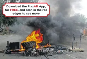  ?? ?? Download the PixzAR App, for and scan in the red
edges to see more
Waste department workers blockaded the premises on Mayor’s Walk with burning tyres, stones, and trees demanding their grievances to be addressed.