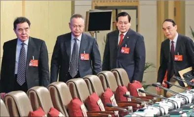  ?? ZHU XINGXIN / CHINA DAILY ?? National People’s Congress officials, led by Liu Binjie (left), chairman of the NPC’s Education, Science, Culture and Public Health Committee, come to meet journalist­s in a news conference in Beijing on Friday.