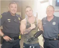  ?? BOYNTON BEACH POLICE DEPARTMENT ?? Chris Ruden stands with Boynton Beach Police Sgt. De Los Rios, left, and Crime Scene Investigat­or Tom McKinlay, who helped recover his missing prosthetic arm Sunday.