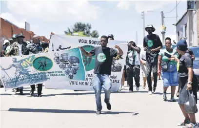  ?? Picture: Nigel Sibanda ?? ON THE ROAD. uMkhonto weSizwe party members march to the Alexandra Stadium, north of Johannesbu­rg, on Saturday where they were addressed by former president Jacob Zuma.
