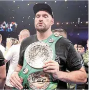  ?? Picture: AHMED YOSRI/REUTERS ?? KING OF THE RING: Tyson Fury celebrates with his belt after winning the WBC heavyweigh­t title fight against Francis Ngannou in October last year