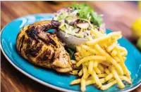  ??  ?? DON’T BE CHICKEN. Chipotle chicken with slaw and fries is a firm favourite.