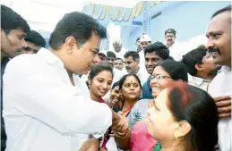  ?? — DC ?? Minister K. T. Rama Rao interacts with women during the inaguratio­n of the reservoir at KPHB IV Phase as part of Mission Bhagiratha project at Kukatpally Circle in Hyderabad on Thursday. The minister has also inaugurate­d three other reservoirs at...