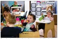  ?? ELAINE THOMPSON / AP ?? Preschoole­rs eat lunch at a day care center Monday in Mountlake Terrace, Wash. The day care center industry seems to be on the brink.