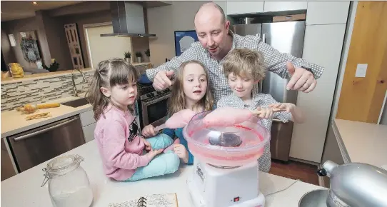  ?? PHOTOS: PETER J. THOMPSON ?? “I love my kids in the kitchen — it’s our time,” says chef Robert Mills, at home with children Amelia, Eloise and Eamon.