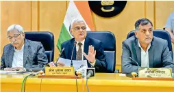  ?? —PTI ?? Chief election commission­er O.P. Rawat flanked by election commission­ers Sunil Arora (L) and Ashok Lavasa (R) address a press conference to announce the dates for elections in five states, in Delhi, Saturday.