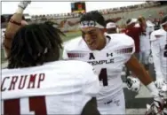  ?? PATRICK SEMANSKY — THE ASSOCIATED PRESS ?? Temple fullback Rob Ritrovato, right, celebrates with teammate Linwood Crump after Saturday’s game against Maryland. Temple won 35-14.