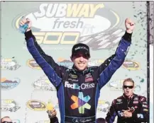  ?? Lesley Ann Miller/associated Press ?? Denny Hamlin celebrated a victory at Phoenix Internatio­nal on Sunday, a track that holds some unpleasant memories for the Fedex driver.