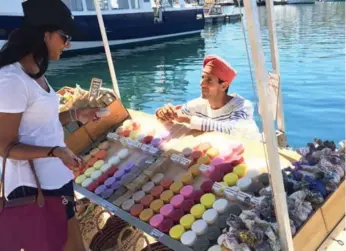  ?? MARCO CHOWN OVED/TORONTO STAR ?? Raf Lefada sells soap at the Old Harbour in Marseille. He believes terrorism isn’t a new threat to the area.