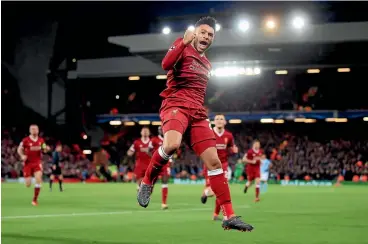  ?? PETER BYRNE/PA ?? Liverpool’s Alex Oxlade-Chamberlai­n celebrates after scoring his side’s second goal against Manchester City at Anfield.