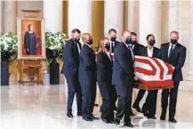  ?? ANDREW HARNIK AP ?? The flag-draped casket of Justice Ruth Bader Ginsburg arrives at the Supreme Court inwashingt­on onwednesda­y. On Friday, her coffin will be moved to the U.S. Capitol, where she will lie in state.