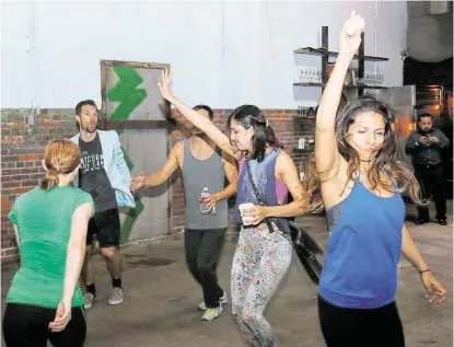  ?? Pin Lim / For the Chronicle ?? Forget about getting crazy and dancing the night away on the weekend. This group gets down at 6:30 a.m. during the work week at a new monthly dance revue called “Wake ‘n’ Shake.” The idea is to get revved up mentally and physically before work. The...