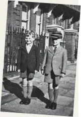  ?? ?? Michael (left) aged six and brother Pieter in the street outside the flat