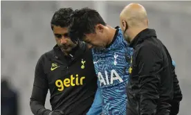  ?? Photograph: Daniel Cole/AP ?? Son Heung-min leaves the pitch in Marseille after being injured during Tottenham’s Champions League game there last week.