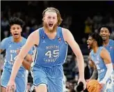  ?? David J. Phillip / Associated Press ?? North Carolina's Brady Manek celebrates after beating Duke in the Tar Heels’ NCAA Tournament semifinal on Saturday in New Orleans.