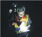  ??  ?? Leeuwkuil CPF Chairperso­n Polla Venter examines a cartridge found on the scene.