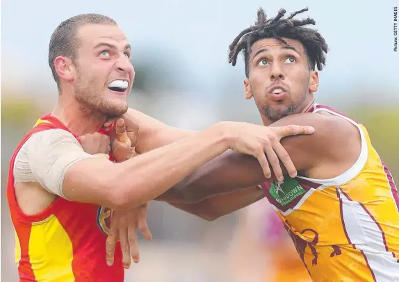  ??  ?? Split webbing during the clash with the Lions may have cost Jarrod Witts, left, with Dan Currie (below) staking his claim to be the No.1 ruckman this weekend.