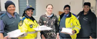  ?? ?? Some of the members who formed part of the operation are, from left: municipal traffic officer Ilse da Silva, provincial traffic officer Awiwe Matiwane, Dr Kimberly Lawrence of George Hospital, provincial traffic officer Gladys Mitara and Sr Codere Februarie, also of the George Hospital.