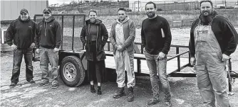  ?? CONTRIBUTE­D ?? Justin Vallis, second from from the right, general manager of Pathways to Employment in Sydney, shows the new trailer Safety Check Inspection­s Ltd. purchased for them after their utility trailer was stolen from their property on Prince Street last week. Vallis said he was surprised and is grateful for all the community support. From left are, Frankie Fahey and Chris Angione co-owners of Safety Check Inspection­s Ltd., Jenna MacKenzie, executive director of Pathways, DJ Griffiths of Pathways, and Pat Carew, field supervisor with Pathways.