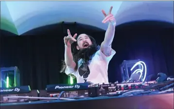  ?? MIKE COPPOLA — GETTY IMAGES ?? Expect guitar-heavy tracks from album “HiROQUEST: Genesis” when Steve Aoki spins March 10in Los Angeles.