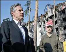  ?? The Associated Press ?? U.S. Secretary of State Antony Blinken stands near a damaged residentia­l building during his visit the city of Irpin, Ukraine, Thursday.