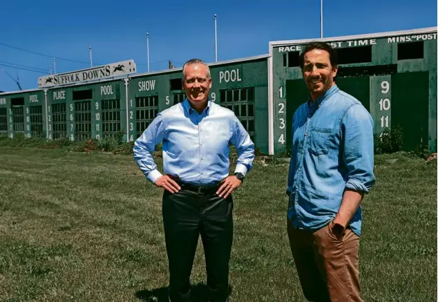  ?? PHOTOS BY DAVID L. RYAN/GLOBE STAFF ?? Tom O’Brien (far left), managing partner and CEO of developer HYM, and Josh Bhatti, senior vice president of the Bowery Presents, on the grounds of Suffolk Downs. The infield of the former racetrack will host a weekend of concerts June 16-18.